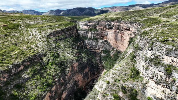 Aerial view of El Vergel canyon featuring steep rock walls lush green vegetation and rugged terrain in Torotoro Potosi Department Bolivia. Aerial view of El Vergel canyon featuring steep rock walls lush green vegetation and rugged terrain in Torotoro Potosi Department Bolivia.