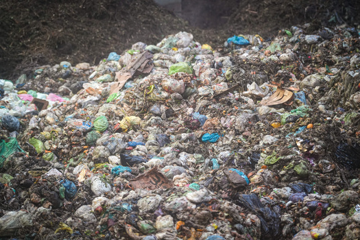 View of a large pile of organic waste and compostable bags at the Forsu Iren treatment plant in Reggio nell Emilia Emilia Romagna Italy. View of a large pile of organic waste and compostable bags at the Forsu Iren treatment plant in Reggio nell Emilia Emilia Romagna Italy.