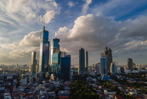 South Jakarta Indonesia 10 January 2026 Aerial view of modern skyscrapers and dense urban residential areas under a dramatic cloudy sky. South Jakarta Indonesia 10 January 2026 Aerial view of modern skyscrapers and dense urban residential areas under a dramatic cloudy sky.