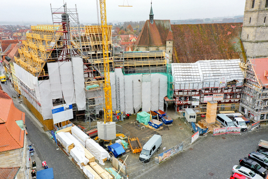 Aerial view of Rathaus Forchheim under renovation with scaffolding and a yellow crane among historic half timbered buildings in Forchheim Bayern Germany. Aerial view of Rathaus Forchheim under renovation with scaffolding and a yellow crane among historic half timbered buildings in Forchheim Bayern Germany.