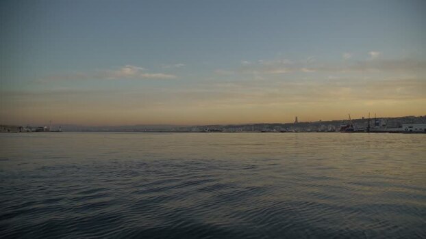 Aerial view of the calm harbor at sunset in Algeria.