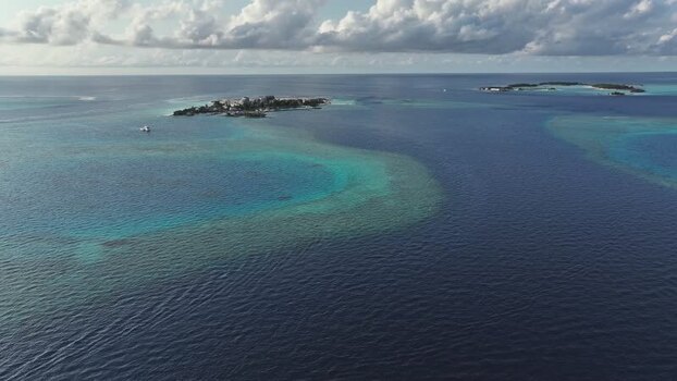Aerial view of tropical islands and turquoise reefs Maldives. Aerial view of tropical islands and turquoise reefs Maldives.