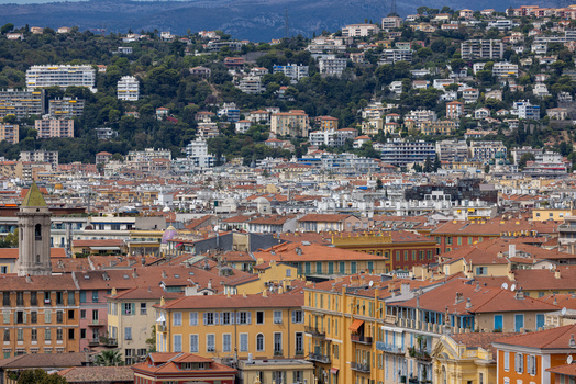 Aerial view of the historic city of Nice featuring dense orange tiled rooftops narrow streets and hilly urban landscape in Nice Provence Alpes Cote d Azur France. Aerial view of the historic city of Nice featuring dense orange tiled rooftops narrow streets and hilly urban landscape in Nice Provence Alpes Cote d Azur France.