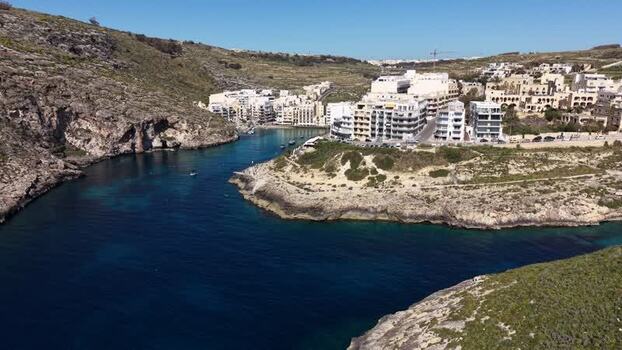 Aerial view of Xlendi Bay and coastal cliffs Malta. Aerial view of Xlendi Bay and coastal cliffs Malta.