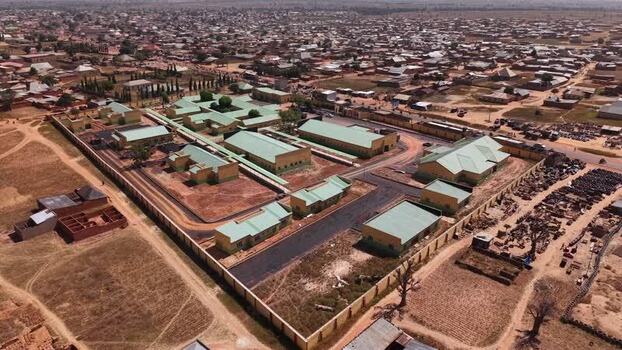 Aerial view of a walled facility with green roofs in Kano Nigeria.