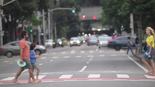 View of people crossing a street in Rio de Janeiro Brazil.