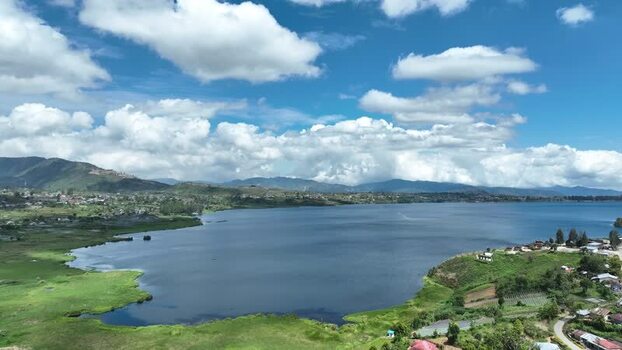 Aerial view of Alahan Panjang lake and green hills Indonesia. Aerial view of Alahan Panjang lake and green hills Indonesia.