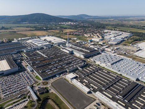 Aerial view of the Volkswagen Slovakia factory complex in Devinska Nova Ves featuring industrial buildings parking lots and hills in Bratislava Bratislavsky kraj Slovakia. Aerial view of the Volkswagen Slovakia factory complex in Devinska Nova Ves featuring industrial buildings parking lots and hills in Bratislava Bratislavsky kraj Slovakia.