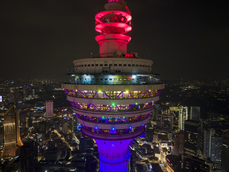 Kuala Lumpur Malaysia 11 March 2026 Aerial view of the illuminated Kuala Lumpur Tower at night with city lights and skyscrapers in the background.