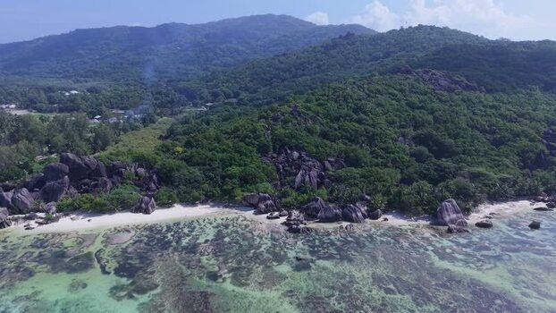 Aerial view of Anse Reunion beach with granite boulders Seychelles.
