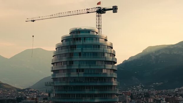 Aerial view of a modern skyscraper under construction in Tirane Albania. Aerial view of a modern skyscraper under construction in Tirane Albania.