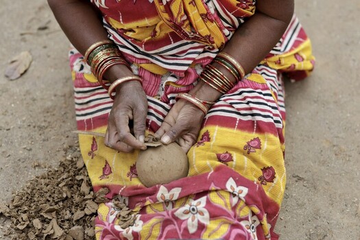 Odisha India 26 March 2026 View of a woman s hands adorned with vibrant bangles meticulously crafting a clay pot against the backdrop of her colorful saree. Odisha India 26 March 2026 View of a woman s hands adorned with vibrant bangles meticulously crafting a clay pot against the backdrop of her colorful saree.