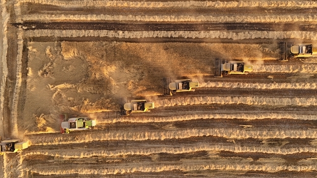 Kadinhani Konya Turkiye 24 September 2026 Aerial view of multiple combine harvesters working in a golden wheat field during the harvest season. Kadinhani Konya Turkiye 24 September 2026 Aerial view of multiple combine harvesters working in a golden wheat field during the harvest season.