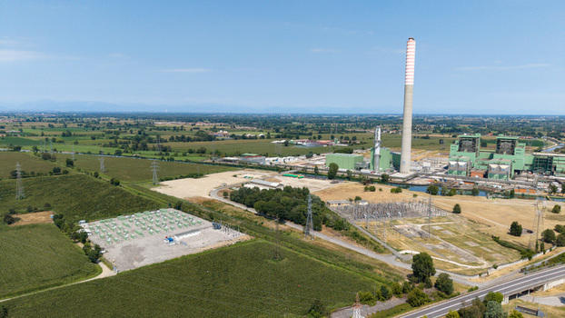 Aerial view of the TTEP Tavazzano thermal power plant and TERNA electrical substation featuring industrial infrastructure and surrounding fields in Tavazzano con Villavesco Lombardy Italy.