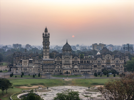 Vadodara India 14 March 2026 Aerial view of Laxmi Vilas Palace featuring its grand Indo Saracenic architecture ornate domes and tall tower under a hazy sunset sky. Vadodara India 14 March 2026 Aerial view of Laxmi Vilas Palace featuring its grand Indo Saracenic architecture ornate domes and tall tower under a hazy sunset sky.