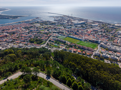 Aerial view of the coastal city of Viana do Castelo with its harbor urban rooftops and lush green hills of Monte de Santa Luzia in Viana do Castelo Viana do Castelo Dist Portugal. Aerial view of the coastal city of Viana do Castelo with its harbor urban rooftops and lush green hills of Monte de Santa Luzia in Viana do Castelo Viana do Castelo Dist Portugal.