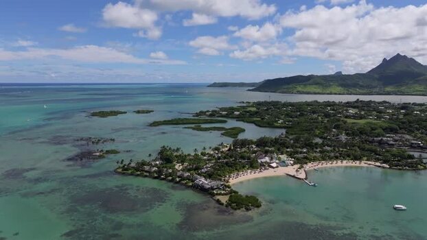 Aerial view of Ile aux Cerfs and turquoise lagoon Mauritius.