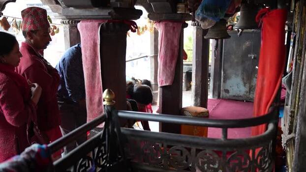 View of people at a traditional temple shrine Nepal.