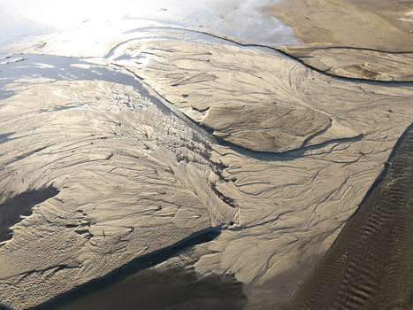 Aerial view of Lake Czorsztynskie with intricate sand patterns and sediment deposits along the shoreline Nowy Targ County Lesser Poland Voivode Poland. Aerial view of Lake Czorsztynskie with intricate sand patterns and sediment deposits along the shoreline Nowy Targ County Lesser Poland Voivode Poland.