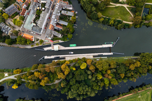 Aerial view of the Spandau Lock surrounded by lush autumn trees urban buildings and the Havel river in Berlin Berlin Germany.