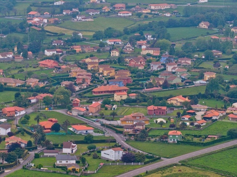 Aerial view of colorful houses and lush green gardens in the village of Cudillero Asturias Spain. Aerial view of colorful houses and lush green gardens in the village of Cudillero Asturias Spain.