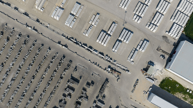 Aerial view of rows of concrete blocks and building materials organized in an industrial storage yard under bright daylight Oosterhout North Brabant Netherlands. Aerial view of rows of concrete blocks and building materials organized in an industrial storage yard under bright daylight Oosterhout North Brabant Netherlands.