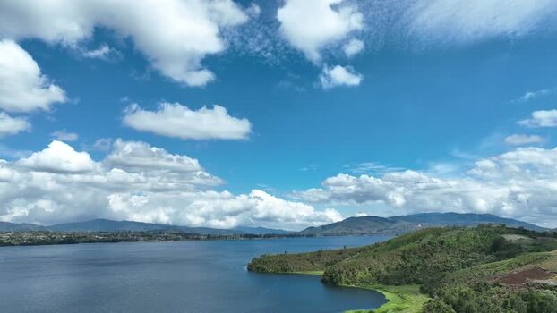 Aerial view of Alahan Panjang lake and green hills Indonesia. Aerial view of Alahan Panjang lake and green hills Indonesia.