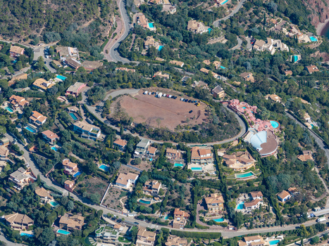Aerial view of Le Trayas featuring luxury villas with swimming pools nestled among lush greenery and winding roads along the hillside. Saint Raphael Provence Alpes Cote d Azur France. Aerial view of Le Trayas featuring luxury villas with swimming pools nestled among lush greenery and winding roads along the hillside. Saint Raphael Provence Alpes Cote d Azur France.