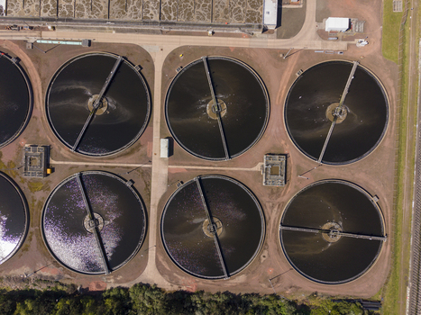 Edinburgh United Kingdom 06 May 2026 Aerial view of circular clarifier tanks at the Seafield Wastewater Treatment Works with rotating bridges and dark water under bright daylight. Edinburgh United Kingdom 06 May 2026 Aerial view of circular clarifier tanks at the Seafield Wastewater Treatment Works with rotating bridges and dark water under bright daylight.