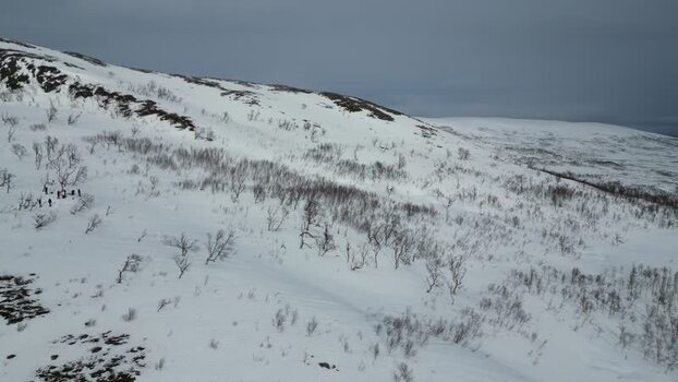 Aerial view of snowy mountain slopes of Kvaloya Norway.