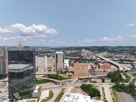 Pittsburgh United States 26 July 2026 Aerial view of the downtown skyline featuring the FNB Financial Center modern skyscrapers historic buildings and riverfront infrastructure.