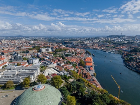 Aerial view of Jardins do Palacio de Cristal with its iconic domed pavilion lush gardens and the Douro River flowing through the historic city of Porto Porto Portugal.