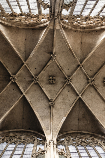 View of the intricate Gothic vaulted ceiling and stone ribs of St. Vitus Cathedral in Prague Prague Czechia. View of the intricate Gothic vaulted ceiling and stone ribs of St. Vitus Cathedral in Prague Prague Czechia.
