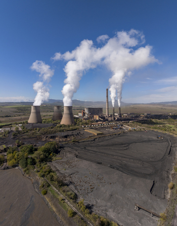 Aerial view of Bobov Dol Power Plant with cooling towers emitting smoke over an industrial landscape in Golemo Selo Kyustendil Province Bulgaria. Aerial view of Bobov Dol Power Plant with cooling towers emitting smoke over an industrial landscape in Golemo Selo Kyustendil Province Bulgaria.