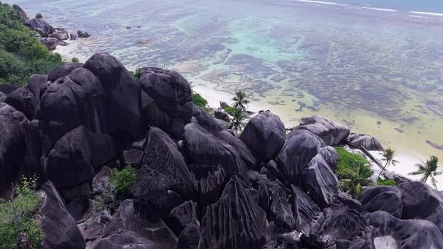 Aerial view of Anse Reunion beach and granite boulders Seychelles.