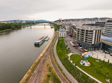 Aerial view of the Danube river with a cruise ship docked near the Eurovea complex and Bratislava Castle in the distance Bratislava Bratislava Region Slovakia. Aerial view of the Danube river with a cruise ship docked near the Eurovea complex and Bratislava Castle in the distance Bratislava Bratislava Region Slovakia.