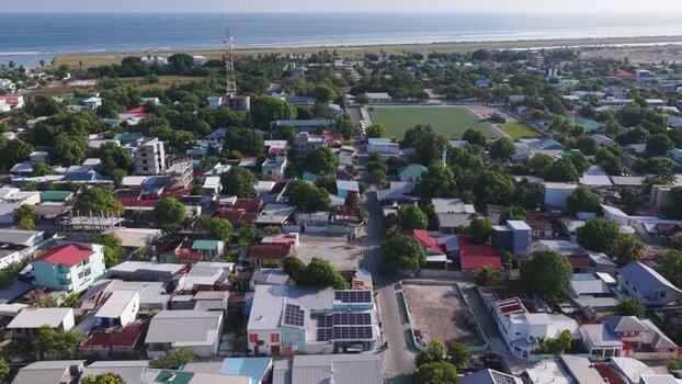 Aerial view of the town of Kudahuvadhoo and the coast Maldives. Aerial view of the town of Kudahuvadhoo and the coast Maldives.