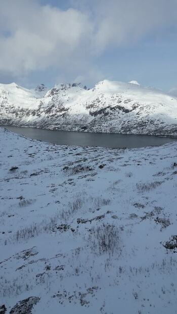 Aerial view of Kvaloya island and snow covered mountains Norway.