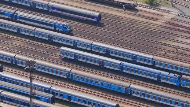 Aerial view of blue passenger trains at a railway depot Czechia. Aerial view of blue passenger trains at a railway depot Czechia.