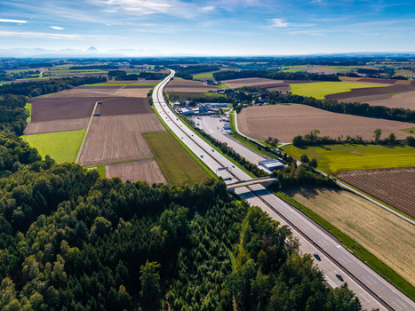 Aerial view of Logistikzentrum Allhaming situated next to a highway surrounded by agricultural fields and forests in Allhaming Oberosterreich Austria. Aerial view of Logistikzentrum Allhaming situated next to a highway surrounded by agricultural fields and forests in Allhaming Oberosterreich Austria.