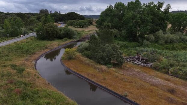 Aerial view of a narrow irrigation canal in the countryside Portugal. Aerial view of a narrow irrigation canal in the countryside Portugal.