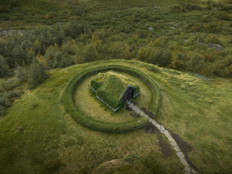 Aerial view of a grass covered building encircled by a vibrant green ring on a hill blending with the surrounding verdant landscape Selfoss Skeiða og Gnúpverjahreppur Iceland. Aerial view of a grass covered building encircled by a vibrant green ring on a hill blending with the surrounding verdant landscape Selfoss Skeiða og Gnúpverjahreppur Iceland.