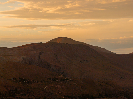 Aerial view of Riserva Naturale Orientata dello Zingaro with rugged hills rocky terrain and soft golden hour light under a cloudy sky in San Vito Lo Capo Sicilia Italy. Aerial view of Riserva Naturale Orientata dello Zingaro with rugged hills rocky terrain and soft golden hour light under a cloudy sky in San Vito Lo Capo Sicilia Italy.