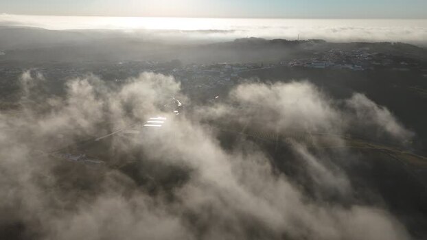 Aerial view of rolling hills and fog in the countryside Portugal. Aerial view of rolling hills and fog in the countryside Portugal.
