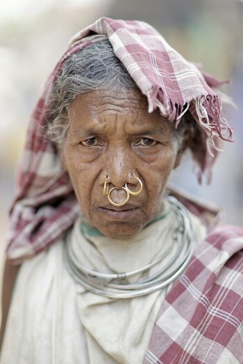 Odisha India 26 March 2026 View of an indigenous woman with weathered skin adorned in traditional jewelry her gaze holding untold stories of resilience and cultural heritage. Odisha India 26 March 2026 View of an indigenous woman with weathered skin adorned in traditional jewelry her gaze holding untold stories of resilience and cultural heritage.