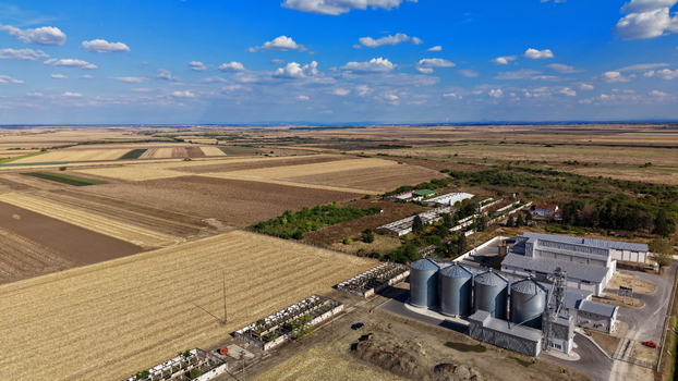 Aerial view of storage silo Bavaniste surrounded by vast agricultural fields and rural landscape in Bavaniste Vojvodina Serbia.