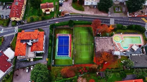 Aerial view of sports complex with tennis and padel courts Italy.
