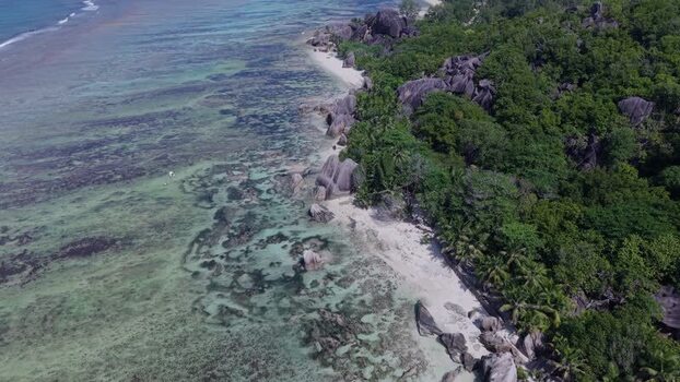 Aerial view of Anse Reunion beach and granite boulders Seychelles.