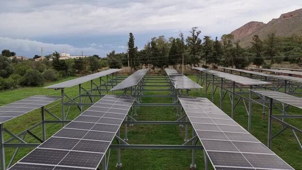 Aerial view of solar panels in a field in Italy.