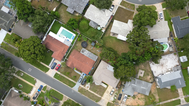 Aerial view of a residential neighborhood with houses swimming pools and green lawns in Clearwater Florida United States.